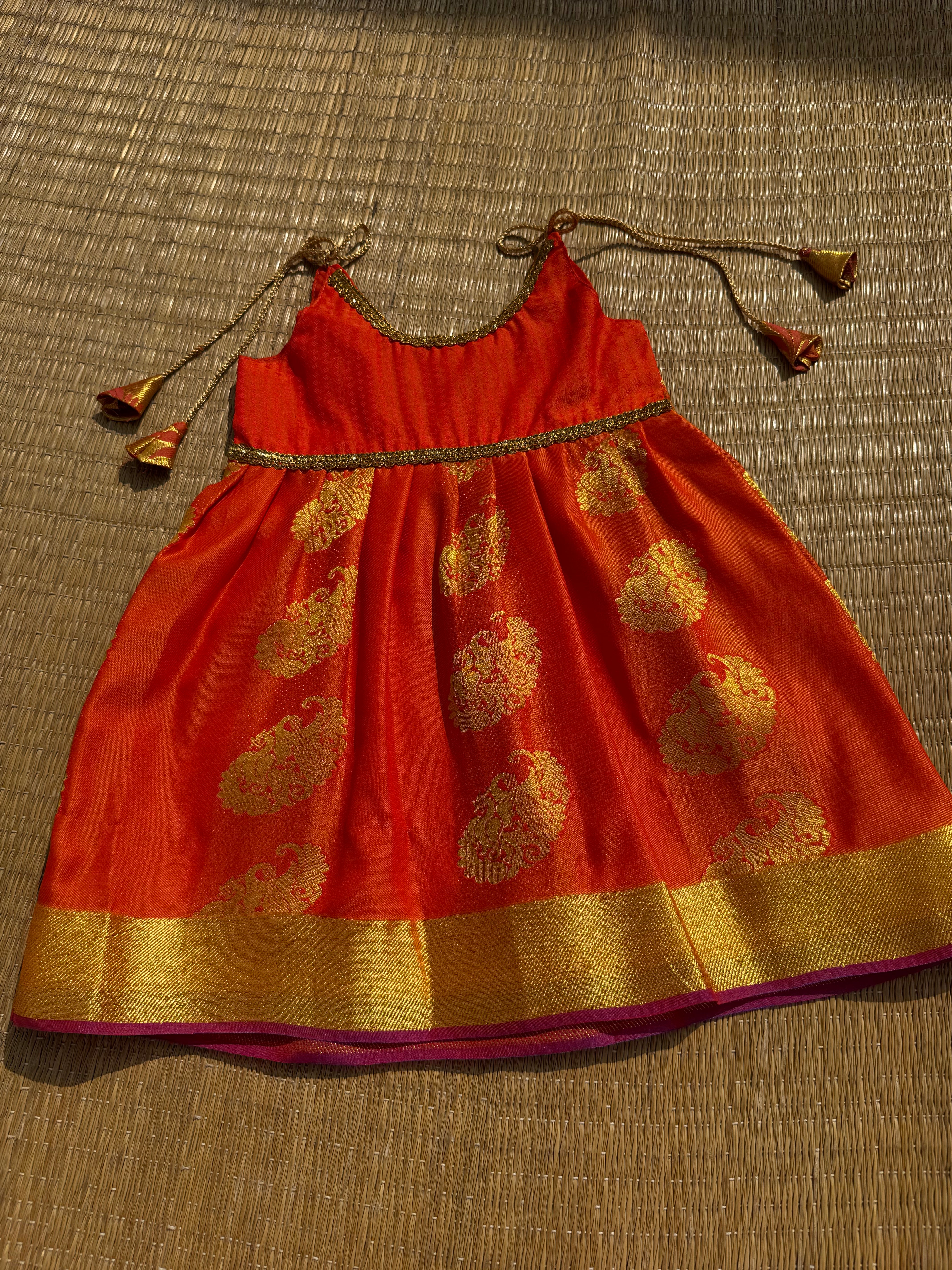 Little Dhiya - Orange with zari tie knot frock for babies